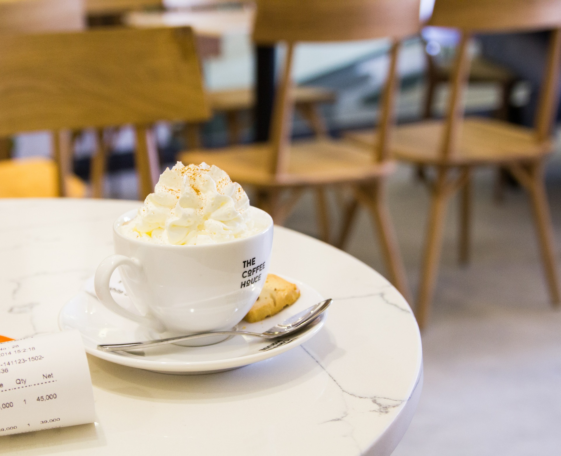 indulgent-coffee-break-with-whipped-cream-and-biscuit